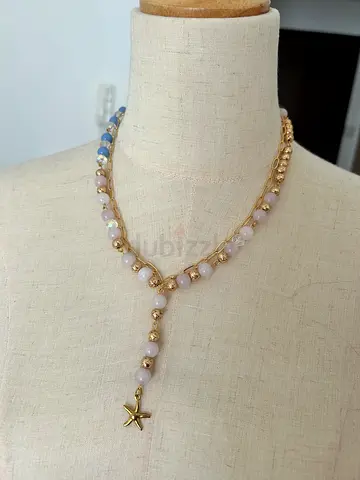 Delicate gold-tone beaded necklace with pastel stones and star charm