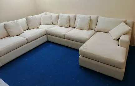 Authentic crate and barrel Ushape sofa for sale beige color
