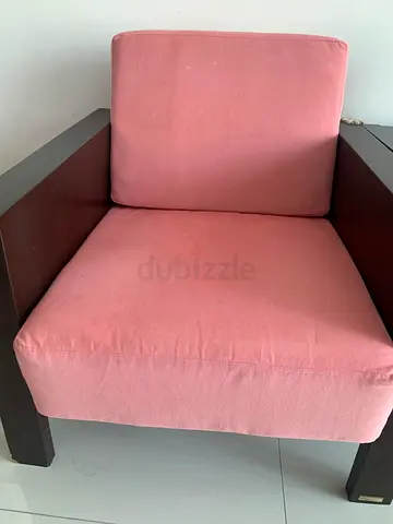 2 Wood-frame armchairs with pink cushions - good condition