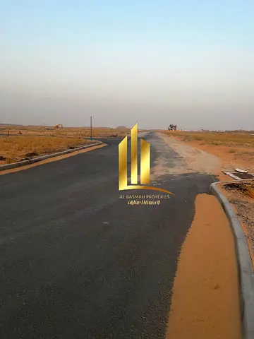 Two residential plots for sale in Sharjah, Al Sahma area, opposite the mosque, second plot from main road 97.