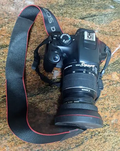 Canon EOS DSLR Camera with 18-55mm Strap, bag and macro lens worth 1000 aed