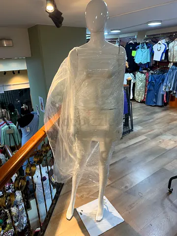 Box of female display mannequin parts — glossy white