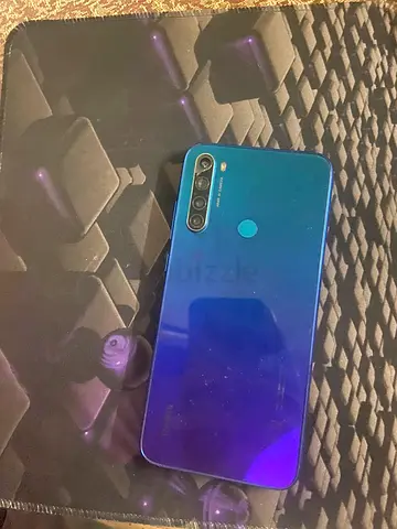 Blue smartphone in good working condition - side view shown
