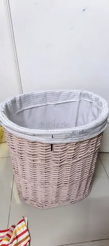 Used white woven laundry basket with removable liner