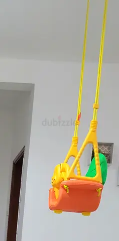 Bright plastic hanging baby swing - good condition