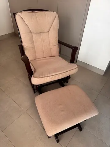 Homecentre Beige cushioned wooden rocking/glider chair with matching footstool. Very high quality.