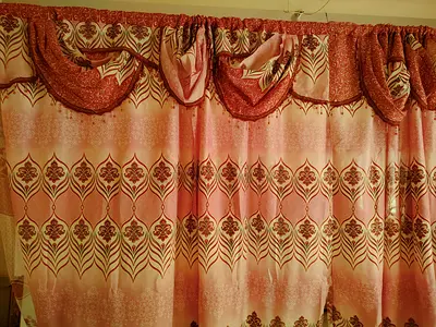 Pink patterned full-length curtains with decorative valance - set of 2
