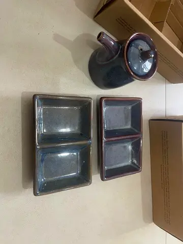 Sushi platter with sauce jar