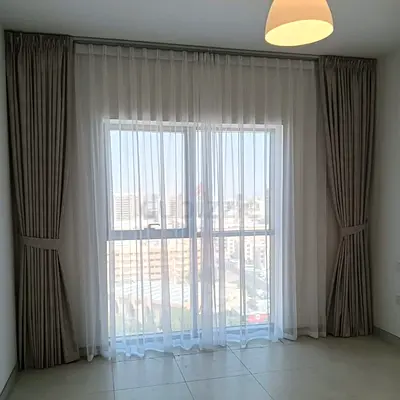 Full-length neutral beige curtains with sheer voile - set for large window