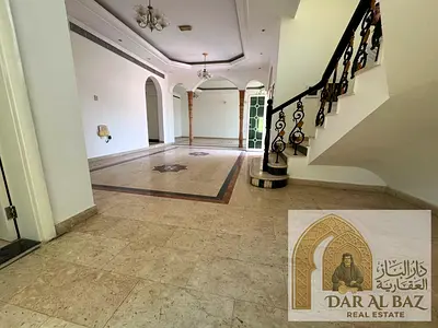 For annual rent: Villa with 4 bedrooms, 7 bathrooms, located in Sharqan area, Sharjah. Features include a covered swimming pool, covered parking for 2