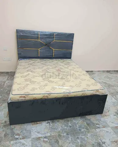 Queen bed frame with mattress - dark grey upholstered headboard