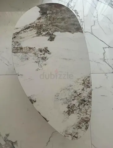Modern abstract white-beige oval area rug — gently used