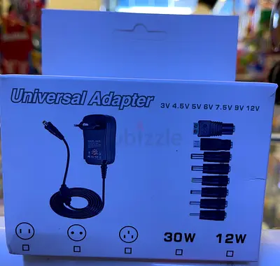 Universal Multi-Voltage AC/DC Power Adapter with 8 Interchangeable Tips (3V–12V)
