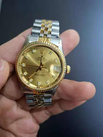 Mens two-tone gold  silver wristwatch with diamond markers,