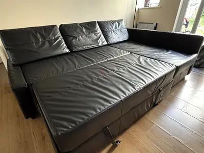 Black leather convertible sofa bed - corner sectional, good condition