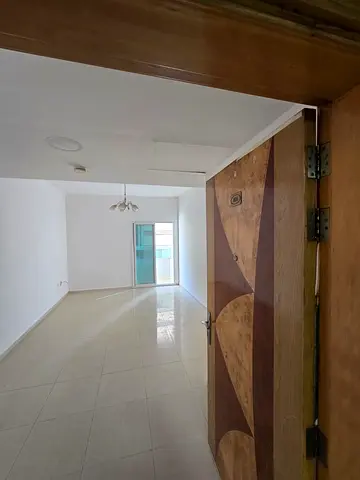 For annual rent: the most spacious one-bedroom apartment (room and hall) with a magnificent sea view, at the lowest price in Sharjah.