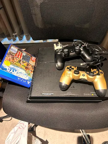 Sony PS4 with 2 Controllers and 2 Games - Good Working Condition