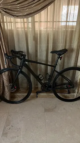Used Matte Black Road Bike - Lightweight Frame, Disc Brakes carbon stiring