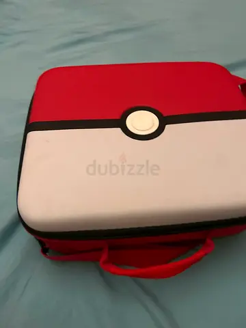 Small red and white hard-shell travel cosmetic case