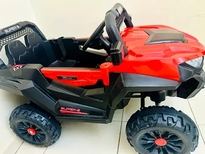 Red Electric Ride-On Toy Car for Kids — 4 Wheels, Battery Powered, and remote controlled.