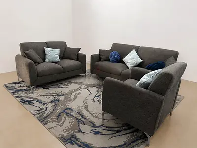 stylish and comfortable 3-piece sofa set in a modern dark grey fabric.