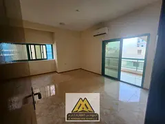 For annual rent in Ajman Corniche, a 2-bedroom apartment with living room, balcony, 2 bathrooms, spl