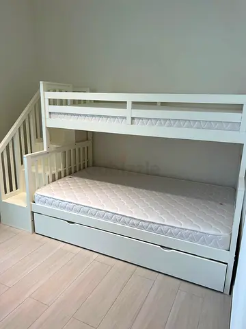 White wooden bunk bed with trundle and staircase - good condition