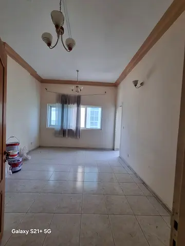 Annual apartment for rent in Al Qasimia Al Mahatta. Two bedrooms, living room, two bathrooms, large balcony, central AC, prime location opposite the p