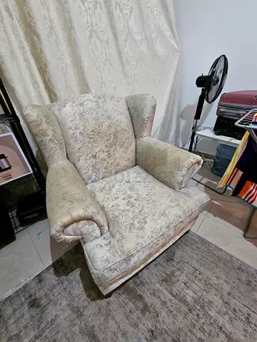 Comfortable vintage-style wingback armchair, good condition