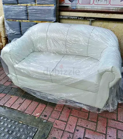 Cream 2-Seater Leather Sofa - Good Condition