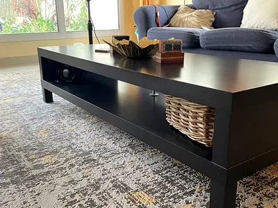 Dark wood rectangular coffee table with lower shelf