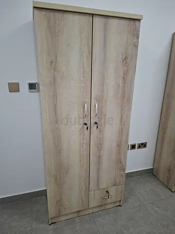 Two-door wooden wardrobe in light oak finish - good condition