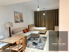 Large studio apartment with a kitchen, bathroom, and high-end finishes. Features include a gym, swim