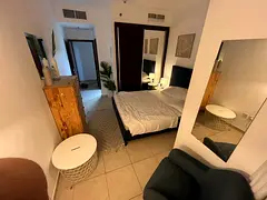 Cozy Master bedroom Attached bathroom with common living area with balcony in Dubai Marina.