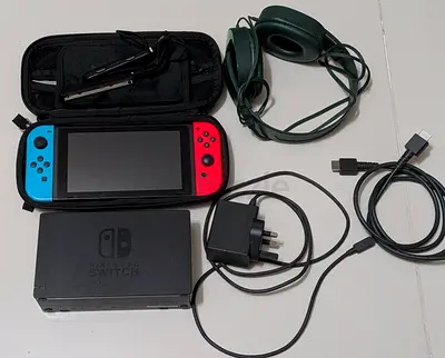Nintendo Switch console with dock, Joy-Con, charger and accessories - used