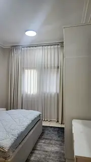 1BR apartment for sale in Al Taawun, Sharjah. Master bedroom, 2 baths, balcony, parking, gym & pool,