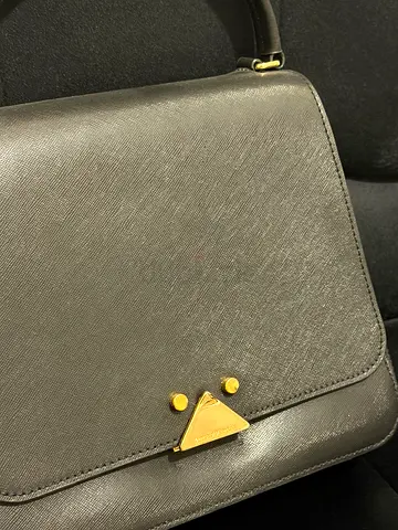 Black structured crossbody bag with gold-tone hardware