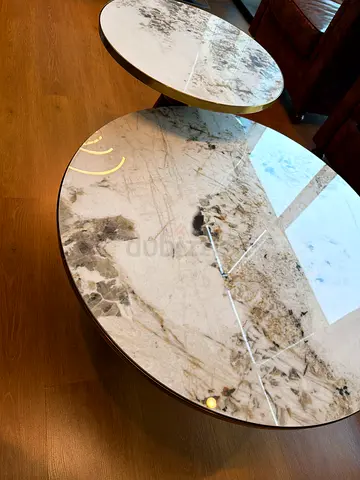 Pair of round marble-top nesting side tables