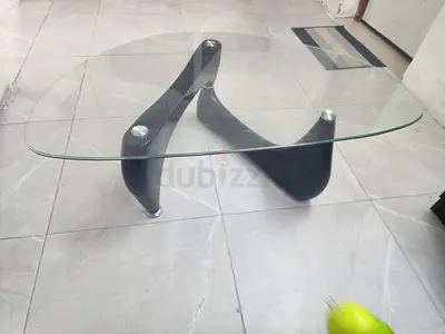 Glass Top Coffee Table with Curved Black Base - Modern Design