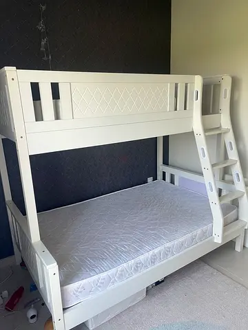 White wooden bunk bed with ladder and mattresses - good condition