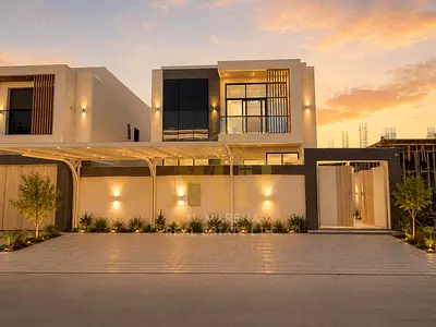 Own a villa for sale in the heart of Al Helio 2, Ajman, with a price that includes registration and