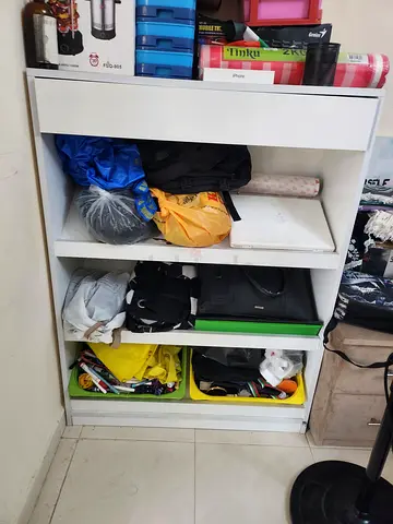 White storage cabinet with open cubbies and drawers - good condition