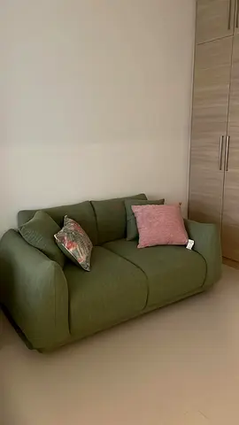 Compact green 2-seater sofa in good condition
