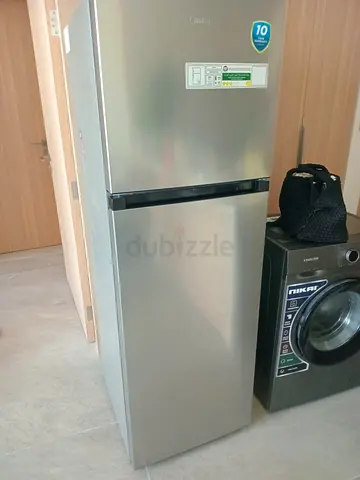 Silver two-door refrigerator - good working condition