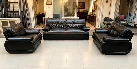 Black leather 3-piece sofa set (2-seater + 2 armchairs) in good condition