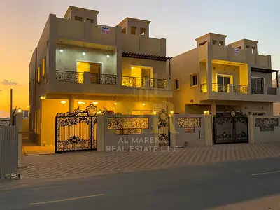 Villa for sale in the heart of Al Helio 2, Ajman, at a price including registration and ownership fees, next to all services, on the main street.