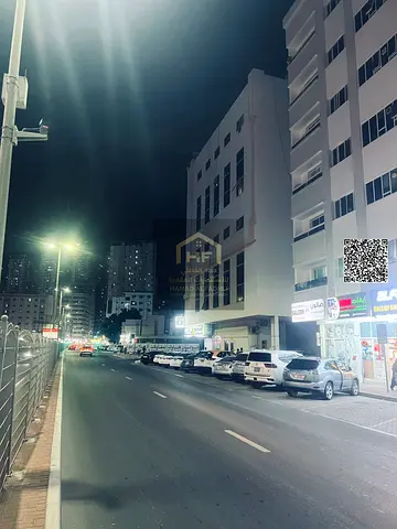 Ground floor and 6-story building for sale Main street Al Rashidiya area Area: 6,000 sq ft Age: 10 years Income: AED 930,000 Consists of: 42 one-bedro