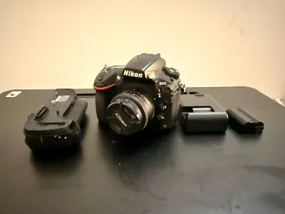 Nikon D810 DSLR with a Nikon 50mm f/1.8 lens and the original Nikon battery grip.