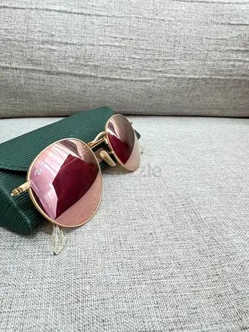 Rayban Round gold-frame sunglasses with pink gradient lenses