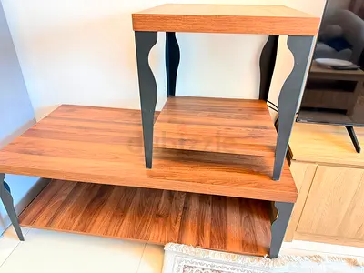 Pair of wooden side/end tables with lower shelf - good condition